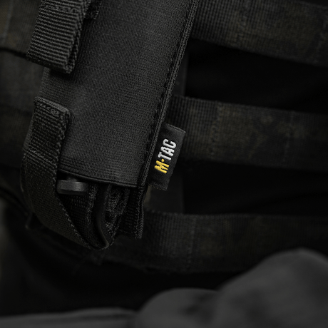 M-Tac Tourniquet Pouch Elastisk VELCRO Gen.II, elastinen VELCRO-tasku mustassa Cordura 500D -materiaalissa, kiinnitetty taktiseen liiviin VELCRO-kiinnityksellä