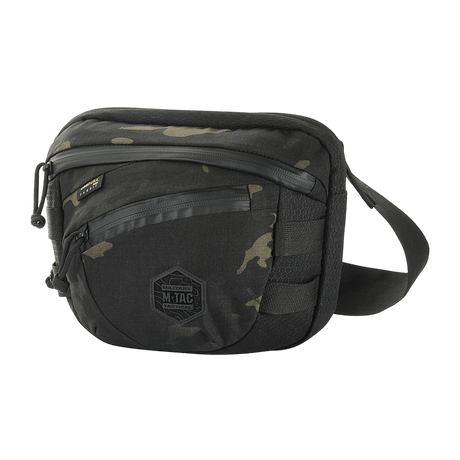 M-Tac Sphaera Hex Hardsling Taske Gen.II Elite mustana ja camouflage-kuvioisena, Cordura-laukku säädettävällä remmillä ja vetoketjullisilla lokeroilla.