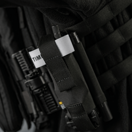 M-Tac Elastisk Tourniquet Pouch Molle Gen.III mustassa Cordurassa kuminauha‑yksityiskohdilla C-A-T tourniquetin kiinnitykseen.