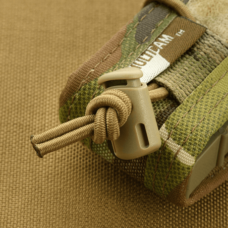 M-Tac Pistol Mag Pouch Gen.3 Cordura 500D säädettävällä MOLLE-kiinnitysjärjestelmällä, näyttää muoviset sivulevyt ja elastiset yksityiskohdat.