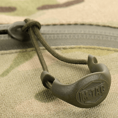 Lähikuva M-Tac Sling Pistoltaske Elite Hexin vetoketjusta, näyttää kestävän Cordura 1000D -materiaalin.