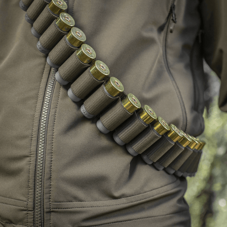 M-Tac Bandolier Elite metsästykseen, patruunat käytännöllisessä vyössä elastisella kiinnityksellä, kapasiteetti 55 patruunaa, ergonominen muotoilu.