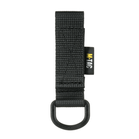 M-Tac D-ring-kiinnike MOLLE-järjestelmään, kompakti ja kevyt taktiseen käyttöön Velcro-lukituksella. Käytännöllinen lisävaruste varusteille.