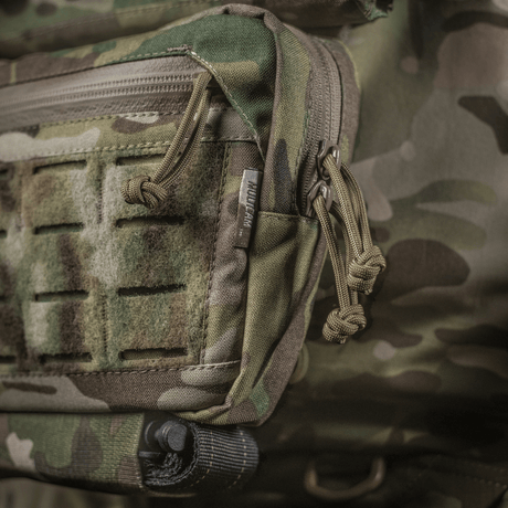 M-Tac Lomme til Tilbehør Lower Large Elite Plate Carrier kestävässä Cordura 500D -materiaalissa, NIJ-sertifiointi, näkymä galleria-asennossa 1, lähikuva vetoketjuista ja materiaalista.