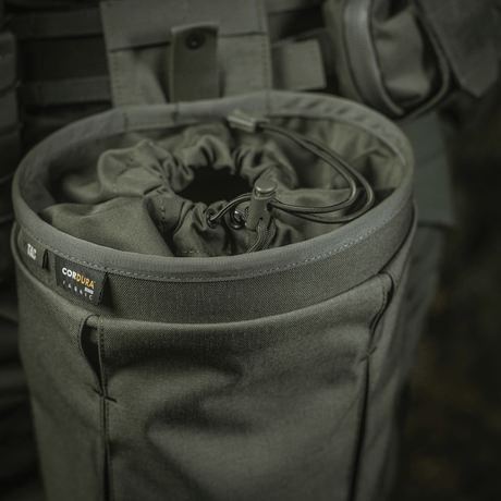M‑Tac Magasinsæk Dump Pouch Lite Elite kestävästä Cordura 500D:stä, quick-pull-suljin ja MOLLE-yhteensopivuus. Käytännöllinen ja kestävä muotoilu.