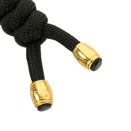 M-Tac Zeus Lanyard, punottu paracord, musta kultaisilla päillä, tyylikäs ja käytännöllinen veitsen lisä.