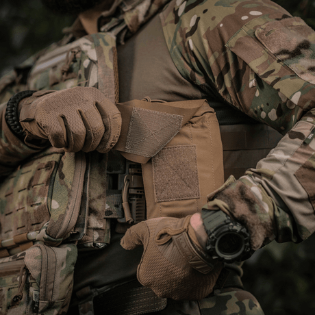 M-Tac Mediclomme Small Vertical Elite kulutusta kestävästä multicam-nylonista NIJ-sertifioinnilla, näytetty sijainti 1, taktista lääkintäsäilytystä varten.