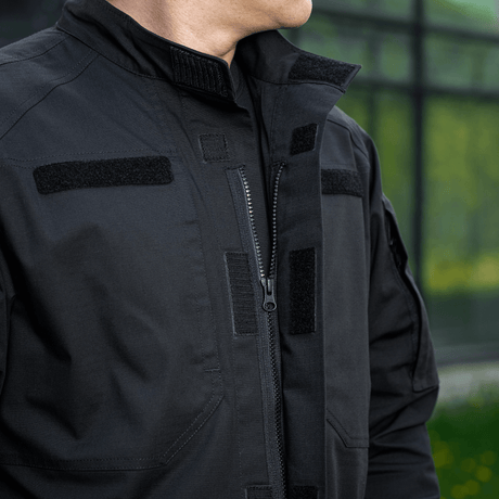 M-Tac Jakke Patrol Flex med Velcro-detaljer og høj kvalitets lynlås, designet til taktisk brug. Sort jakke med ID-paneler.