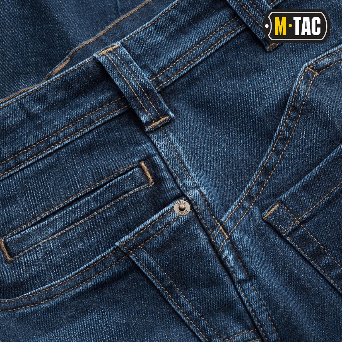 Nærbillede af M-Tac Tactical Gen.I Regular Fit jeans med fokus på detaljer og syninger.