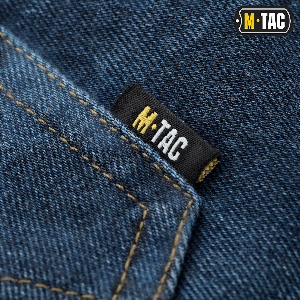 M-Tac Jeans Tactical Gen. I Cordura Regular Fit - close-up af stærk denimmateriale med M-Tac label og forstærket syning