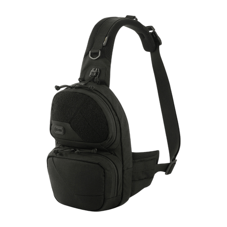 M-Tac Buckler Taske Elite mustana MOLLE-järjestelmällä, kaksi ulkotaskua ja piilotettu asekotelo, valmistettu Cordura 500D -materiaalista.