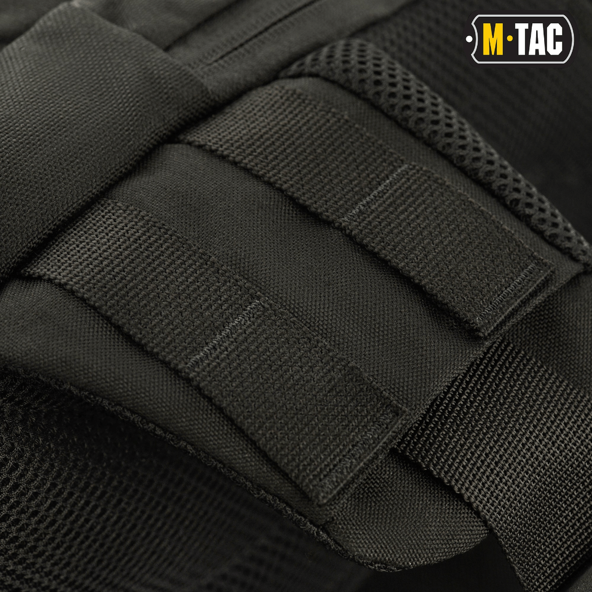 M-Tac Buckler Taske Elite med MOLLE-system i sort Cordura 500D, tæt visning af design og stropper.
