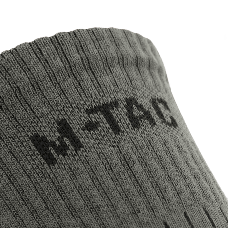 M-Tac Sokker Mk.1 med ribstrik design, komfort og støtte under krævende aktiviteter. Ideel til langdistanceture.
