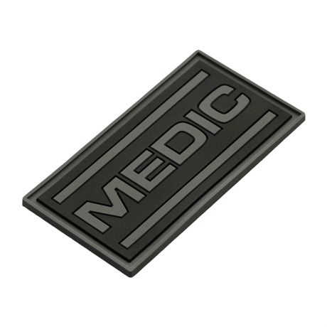 M-Tac Patch Medic PVC 3D taktinen patch Velcro-kiinnityksellä, musta muotoilu ja 3D-efekti. Mitat: 70 x 35 mm. Sopii univormuihin ja laukkuun.
