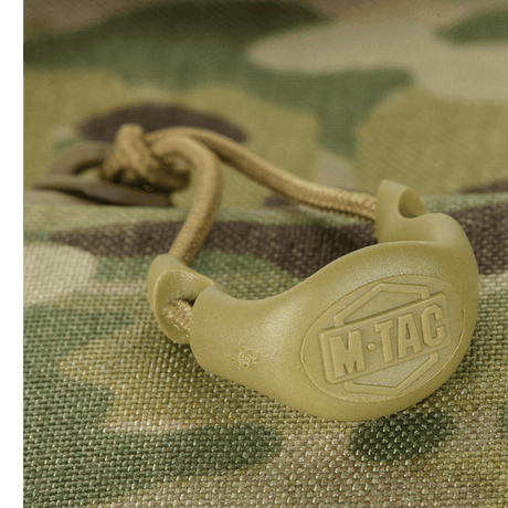 M-Tac Konvert Taske Elite kestävistä materiaaleista, lähikuva snørelukningista ja camouflage-stofista Cordura-kankaassa.