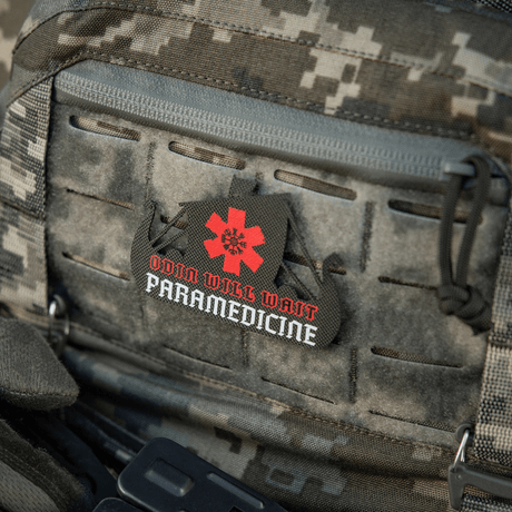 M-Tac Patch Viking Evac maastokuvioisessa asepussissa tekstillä "Odin Will Wait Paramedicine"