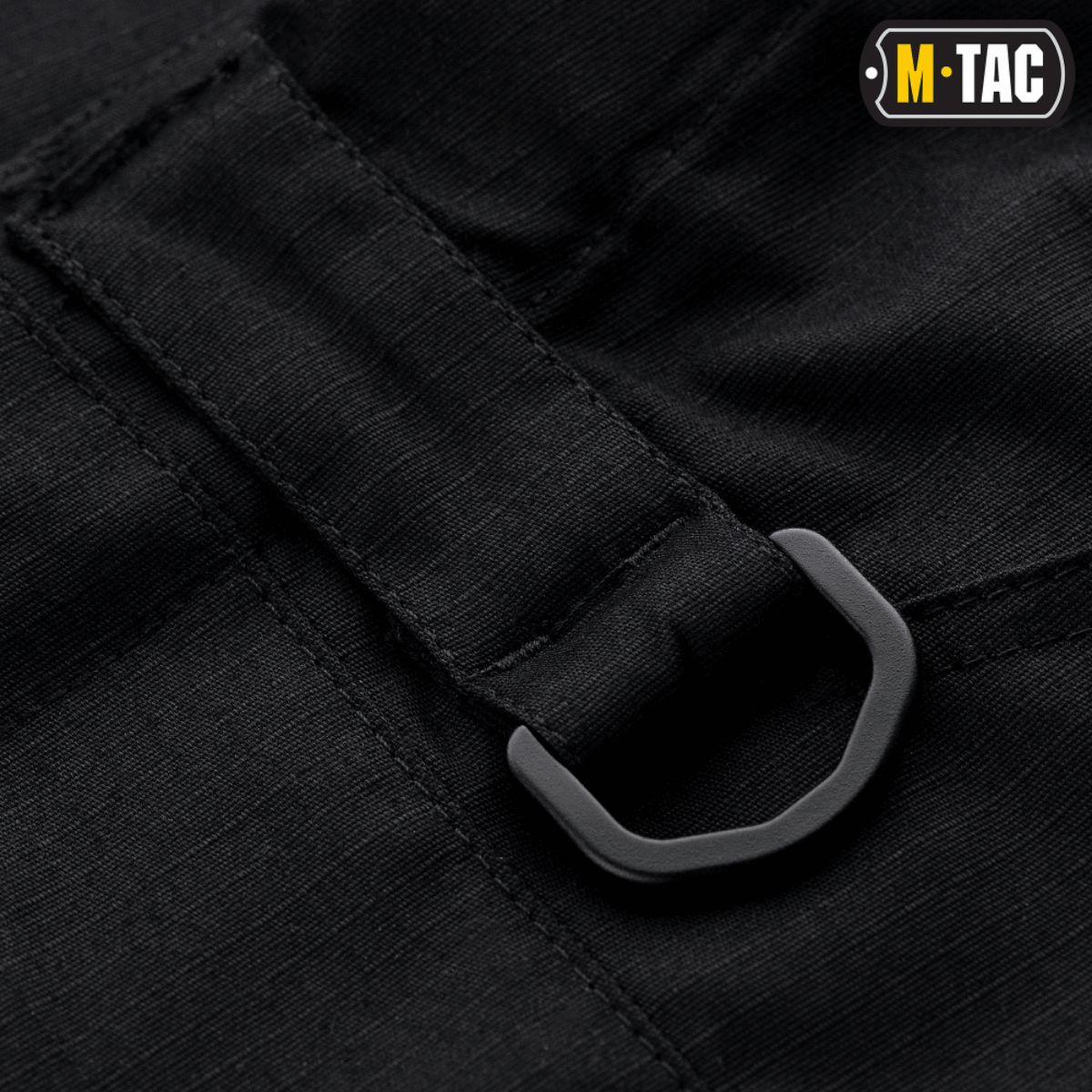Detalje af M-tac Taktiske Bukser Conquistador Gen. I Flex med robust D-ring og polycotton Rip-stop Flex stof i sort.