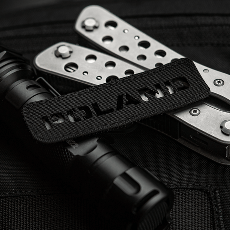 M‑Tac Patch Poland End-to-End 25x80 perforoitu Cordura 500D -tarra laserleikatuilla kuvioilla, kiinnitetty varusteisiin tarralla.