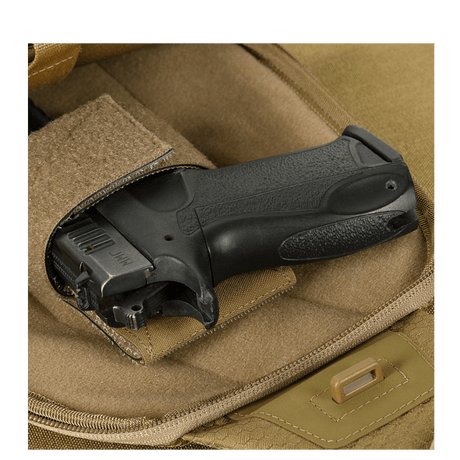 M-Tac Buckler Taske Elite Hex, piilotettu kantotoiminto ja MOLLE-järjestelmä Hex-Cordura-materiaalista. Sopiva turvalliseen aseiden säilytykseen.