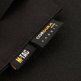 M-Tac Double Mag Pouch Hook Backed Magazine med Cordura mærkeetiket, designet til at transportere to pistolmagasiner og lignende genstande.