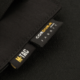 M-Tac Double Mag Pouch Hook Backed Magazine, fremstillet af slidstærkt CORDURA-stof med mærkninger, designet til modulær opbevaring.