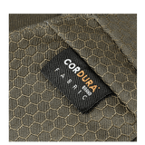 Nærbillede af Cordura-stofetiket på M-Tac Magnet XL Taske Elite Hex med sekskantet mønster.