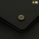 Detalje af M-Tac Pung Slim Elite Gen. II med messingnitte og moderne design, kompakt og holdbar i polymerkomposit.