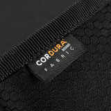 Nærbillede af M‑Tac Pung Elite Gen.II Hex lavet af Cordura Hex 1000D stof med synlig mærkat.