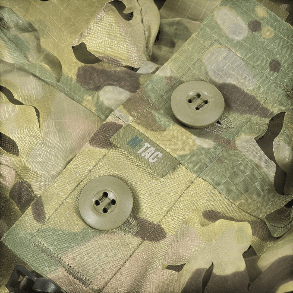 Detalje af M-Tac Alder Camouflage Suit med Laser Cut teknologi til skjult terrænkamouflage.