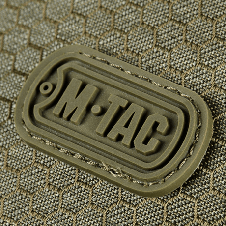 M-Tac Cross Taske Slim Elite Hex logo på en stilfuld taske lavet af Cordura materiale, viser holdbarheden og kvaliteten af produktet.