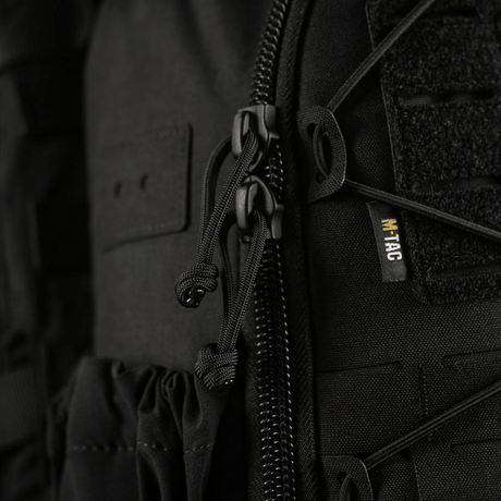 M-Tac STURM Elite Rygsæk med laser skåret MOLLE frontpanel, nærbillede af lynlås og detaljering, fremstillet af Cordura materiale.