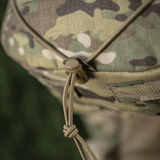 Nærbillede af en M-Tac STURM Elite Rygsæk med camouflagedesign og snørelukning. Fremstillet af Cordura-materialer til taktisk brug.