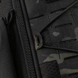 M-Tac STURM Elite Rygsæk med detaljebillede af lynlås og MOLLE panelet i Cordura materiale, designet til taktisk brug.
