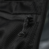 M-Tac STURM Elite Rygsæk mesh-lomme detaljeret visning, sort materiale i Cordura med lynlås, designet til taktisk brug.