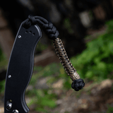 M-Tac Knife Lanyard Scandinavian - flettet paracord lanyard på lommekniv for stilfuldt og praktisk brug.