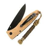 Flettet M-Tac Knife Lanyard Scandinavian i paracord, fastgjort til sammenklappelig lommekniv, tilføjer stil og funktionalitet.