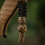 M-Tac Lanyard Scandinavian Small Chinese Knot med dekorativ perle. Stilfuldt tilbehør af snoet paracord, ideel til knive og lommelygter.