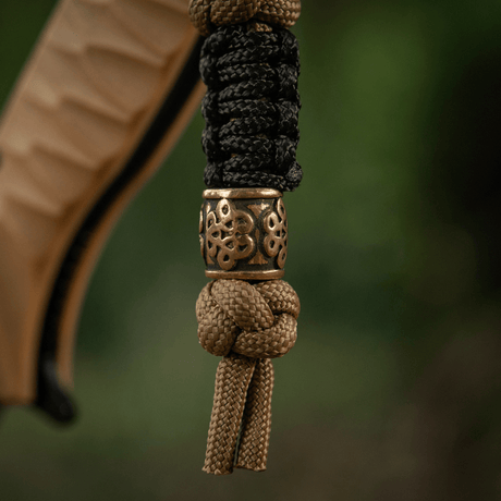 M-Tac Lanyard Scandinavian Small Chinese Knot med dekorativ perle. Stilfuldt tilbehør af snoet paracord, ideel til knive og lommelygter.