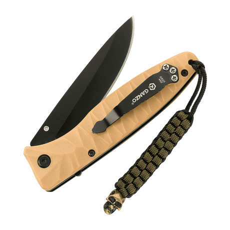 M-Tac Knife Lanyard Cuboid Skull på brun lommekniv med paracord og en dekorativ Cuboid Skull-perle for et unikt og taktisk look.