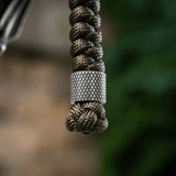 M-Tac Viper Lanyard Stainless Steel med flettet paracord og rustfri stålperle, fleksibelt knivtilbehør til hurtig adgang.