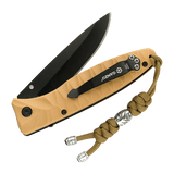 M-Tac Zeus Stainless Steel Lanyard på en kniv, flettet paracord med dekorativ stålperle, praktisk til hurtig adgang til udstyr.