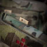 M-Tac Lomme til Tourniquet Closed i camouflage-design for optimal beskyttelse og tilgængelig opbevaring af førstehjælpsudstyr.