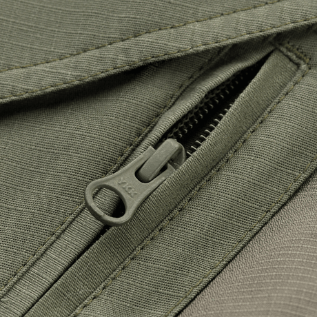 Lukning på M-Tac Shorts Aggressor Gen.II Flex med vand- og smudsafvisende rip-stop materiale.