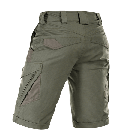 M-Tac Shorts Aggressor Gen.II Flex i grøn farve, bagfra, viser rip-stop materiale og taktisk design med lommer og bæltestropper.