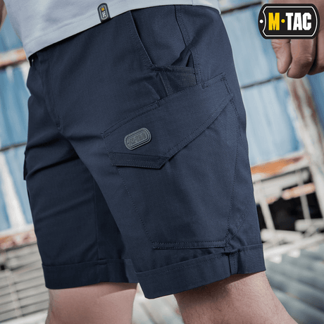 M-Tac Shorts Aggressor Short i marineblå med taktiske lommer designet til komfort og bevægelsesfrihed, perfekt til by- eller naturbrug.