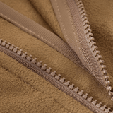 Nærbillede af lynlåsen på M-Tac Norman Windblock Fleecejakke, viser detaljeret WindBlock-materiale og Softshell-indlæg.