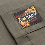 M-Tac Jakke Patrol Flex label med "Born by Revolution" og "War Hardened" design i grå farve