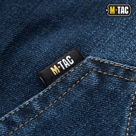 Tæt på M-Tac Tactical Gen.I Regular Fit jeans med M-Tac-logo.