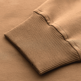 Detalje af M-Tac Pullover 4 Seasons, der viser ribkantede manchetter i beige bomuldsmateriale, ideel til daglig brug hele året.