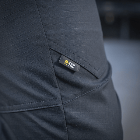 M-Tac Tactical Bukser Patrol Gen II Flex i nærbillede med M-Tac logo på lommen.